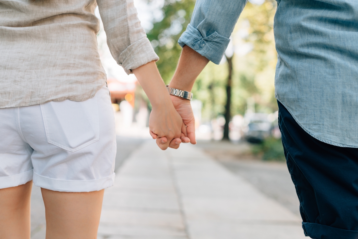 Couple holding hands on the street 7K pictures