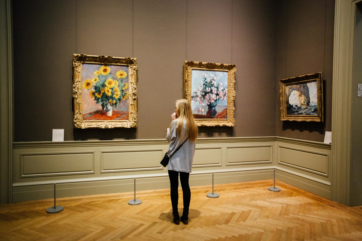 A woman watching an art exhibition in an art exhibition 4k