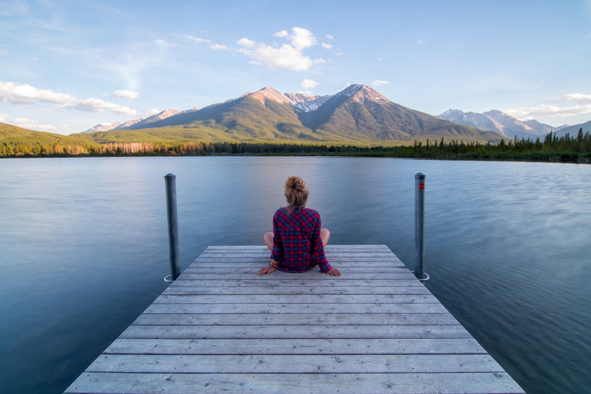 Serene scenery of lake mountains girl