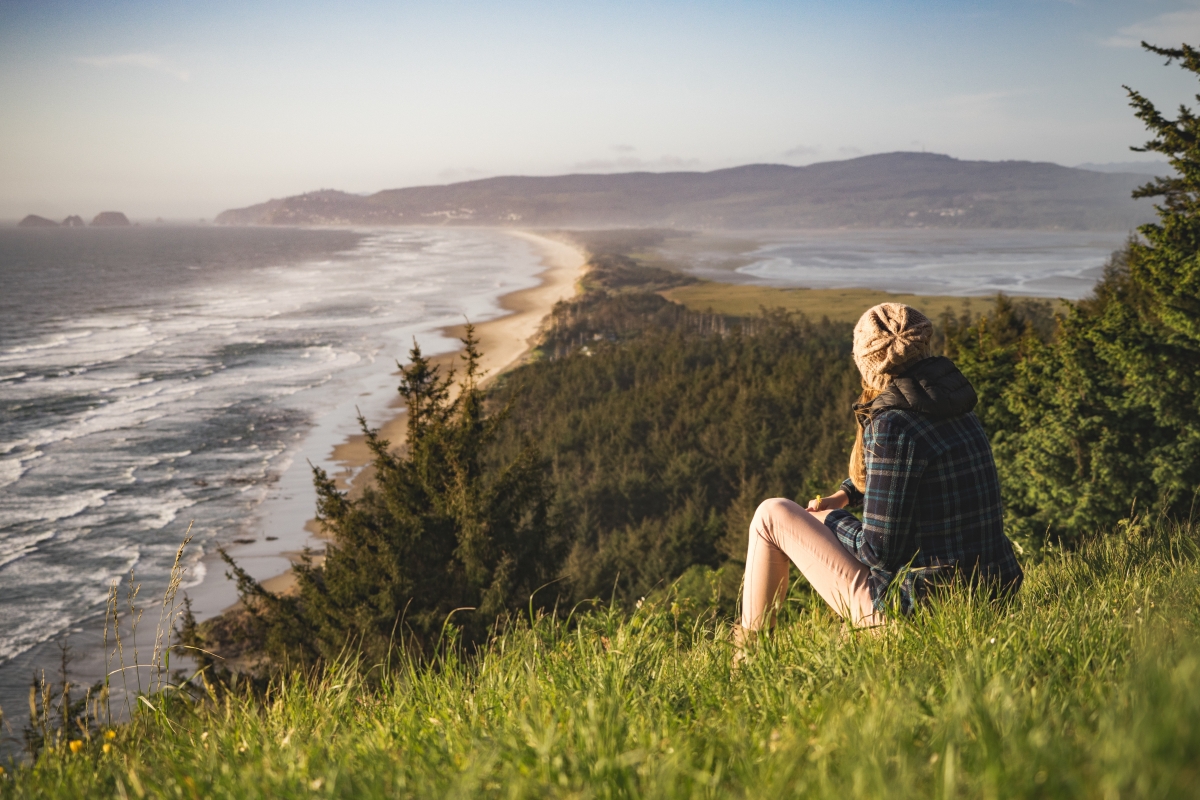 Shore, woman on the slope, people