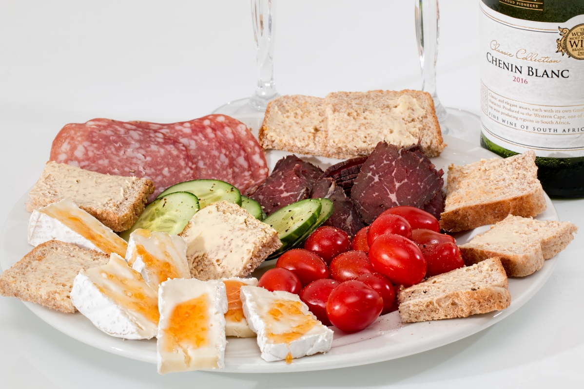 Smoked beef with cheese salami on plate