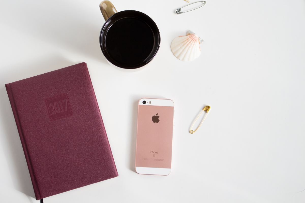 Apple, coffee, notebook, shells,