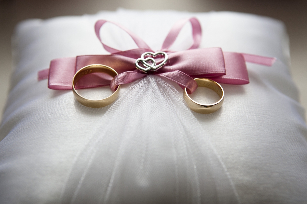 Picture of ring on white wedding dress