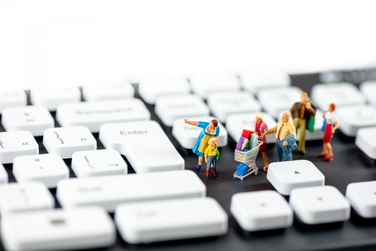 Creative photo by keyboard shopping little people