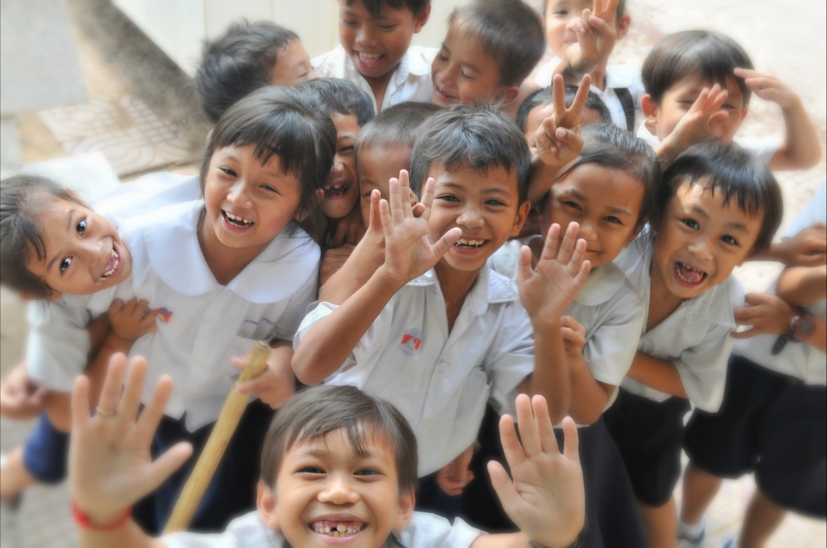 The children danced and laughed happily
