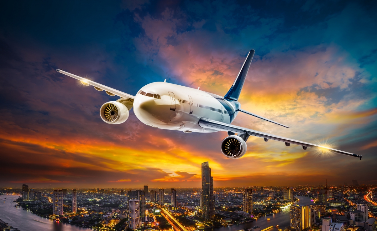 Airplane sky flying night city