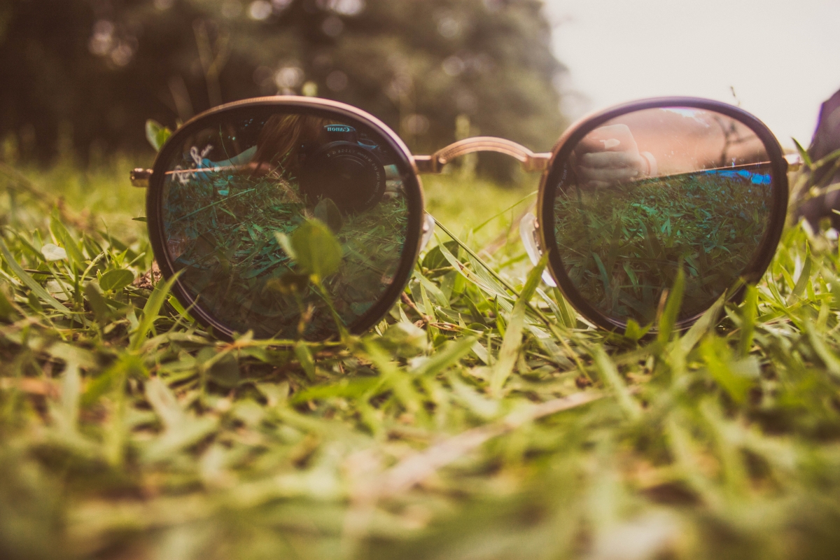 Glasses on the grass 4k picture