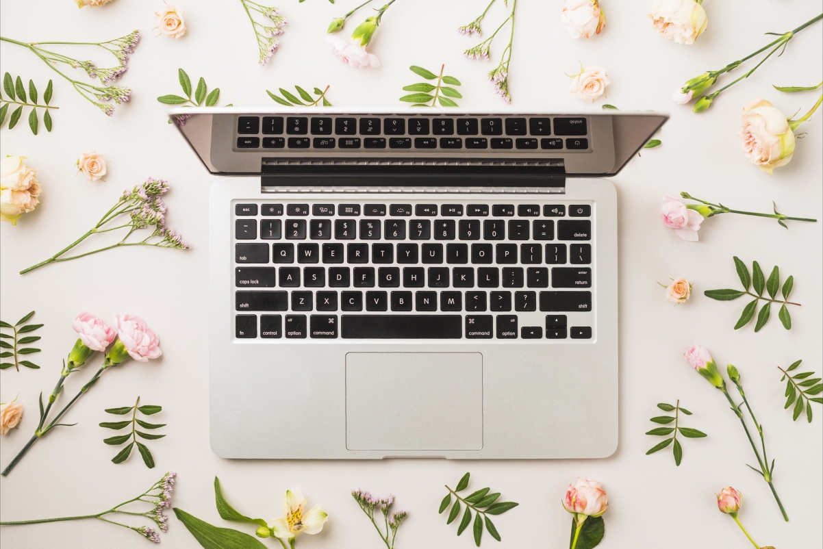 Laptop keyboard flowers back